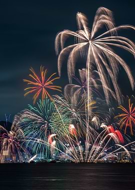 Fireworks Display Over City at Night