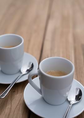 Two Cups of Espresso on Wood