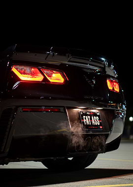 Black C7 z06 Corvette with Quiet Custom License Plate