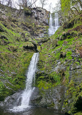 Waterfall cascading down mossy rocks