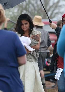 Selena Gomez Holding Baby on Set
