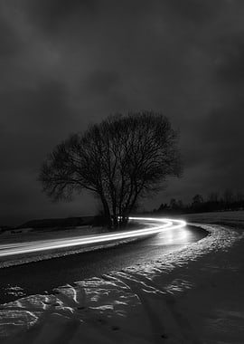 Monochrome Winter Road with Light Trails