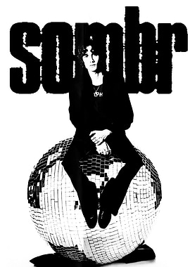 Sombr sitting on a disco ball