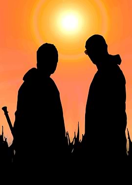 Silhouette of two people at sunset