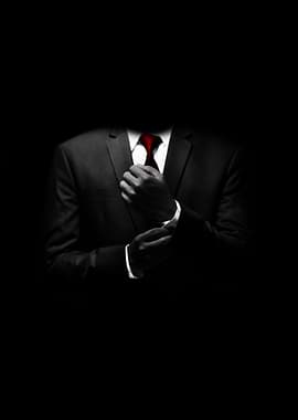 Man in Suit Adjusting Cufflinks