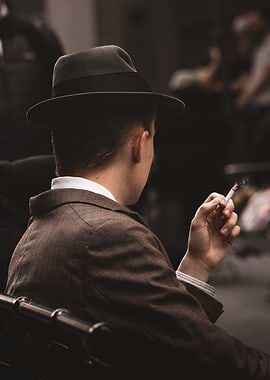 Man in Hat Smoking Cigarette