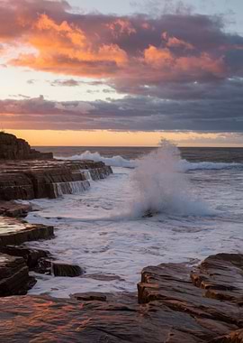 Coastal Sunset with Crashing Waves