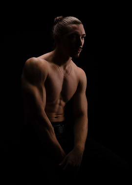 Muscular Man Portrait in Dark Setting
