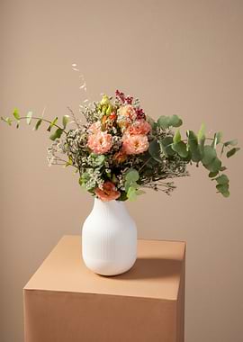 Floral arrangement in white vase
