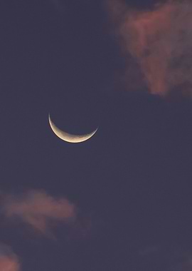 Crescent Moon in a Cloudy Sky