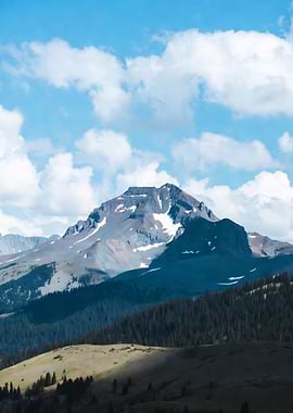 Mountain Peak Under Cloudy Sky