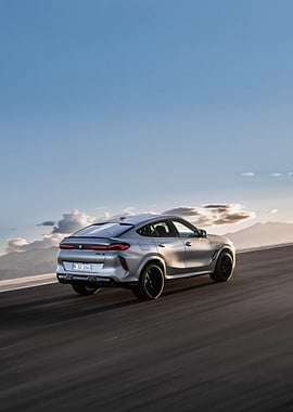 Silver BMW X6 M on Road