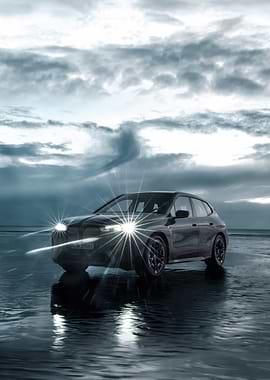 BMW iX electric car on beach