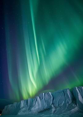 Aurora Borealis over icy landscape