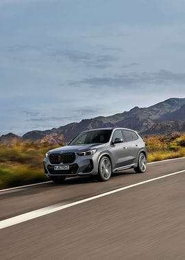 Silver BMW X1 on Open Road