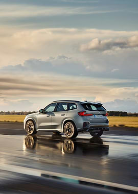 Silver BMW X1 on Wet Road
