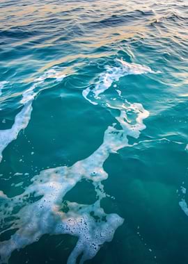 Turquoise Ocean Water with White Foam