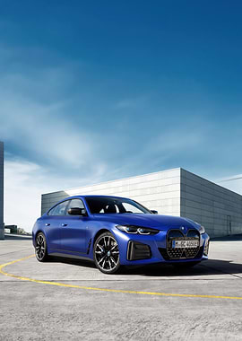 Blue BMW i4 on Concrete Surface