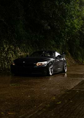 Black BMW Z4 on Wet Road
