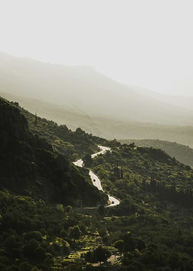 Winding Mountain Road with Cars