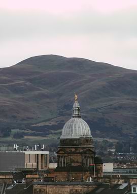 Edinburgh cityscape with dome and mountain