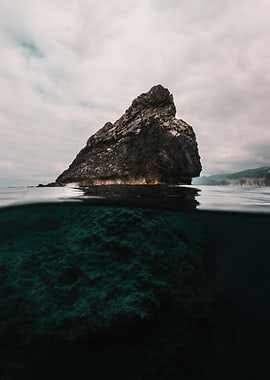 Island Rock Formation Half Underwater View