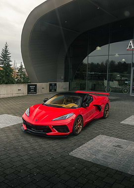 Red Corvette C8 in front of Tacoma car Museum