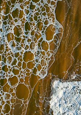 Aerial view of foamy ocean waves