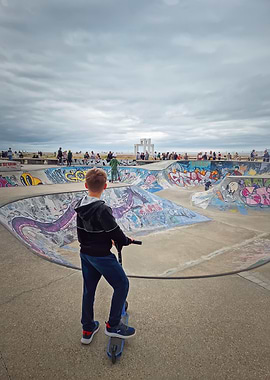 Boy on scooter at skatepark