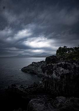 Dark Coastal Landscape with Stormy Sky