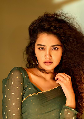 Portrait of a woman with curly hair anupama