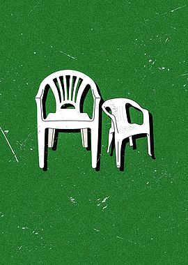Two White Plastic Chairs on Green