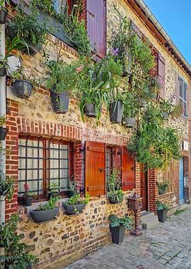 Charming Stone Building with Flower Pots