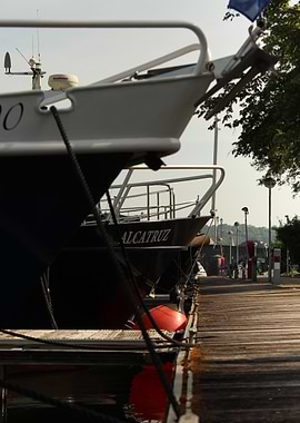 Boats docked at a wooden pier