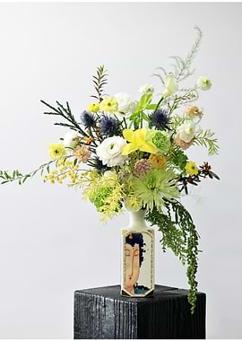 Floral arrangement in decorative vase
