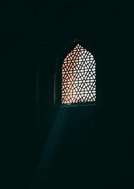 Ornate Window with Light Beam