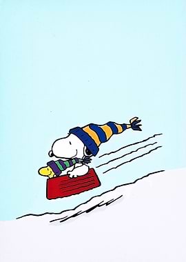 Snoopy sledding down a snowy hill