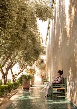 Woman Relaxing in a Courtyard