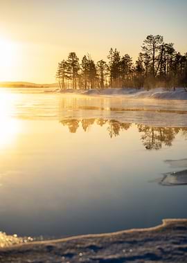 Winter landscape with frozen lake
