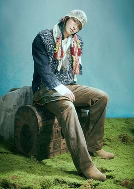 Man in Boho Style Sitting on Chest