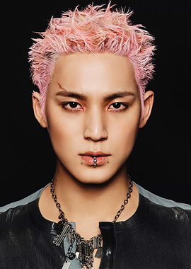 Portrait of a man with pink hair