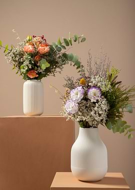 Two Floral Arrangements in White Vases
