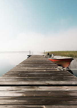 Dock with Boat on Misty Lake