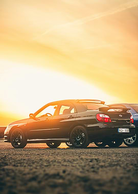 Black Subaru Impreza at Sunset