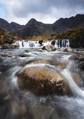 Waterfall in Scotland with Mountains