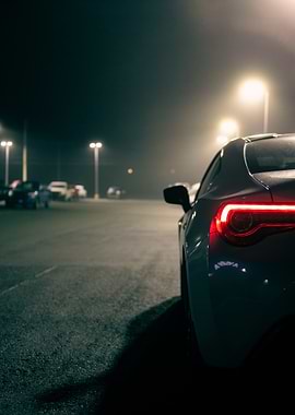 Car in Foggy Parking Lot