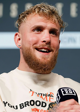 Jake Paul smiling at a press conference