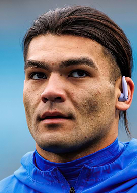 Close-up of Man with Earbud puka nacua