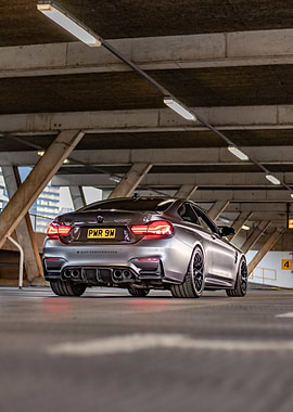 Silver BMW M4 in Parking Garage