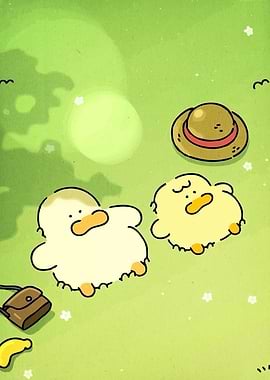 Ducks relaxing on green grass